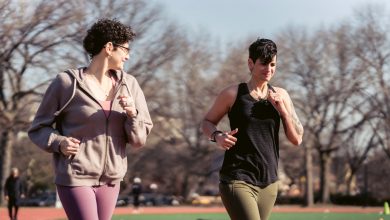 young girlfriends running at stadium