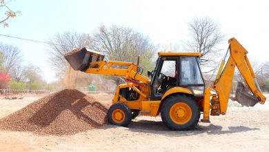 yellow front loader at construction site