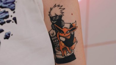 tattoo of a manga character on a mans arm